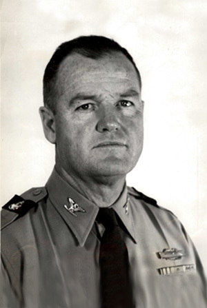 Headshot of COL W. J. Mullen in black and white with a simple background