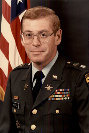 Headshot of LTC Douglas Hemphill with an American flag in background