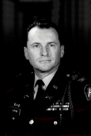 Headshot of COL J. J. Lavin in black and white with a simple background