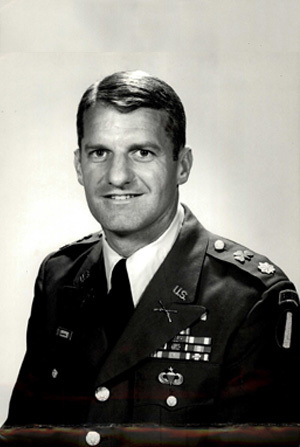 Headshot of LTC J. A. Mussleman in black and white with a simple background