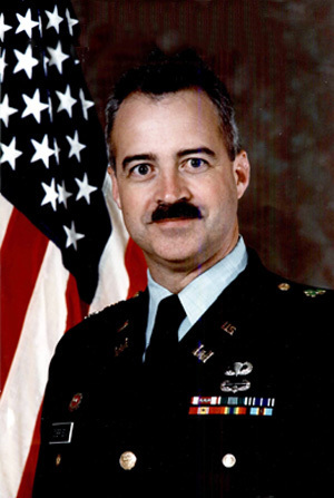 Headshot of LTC James O'Brien with an American flag in background