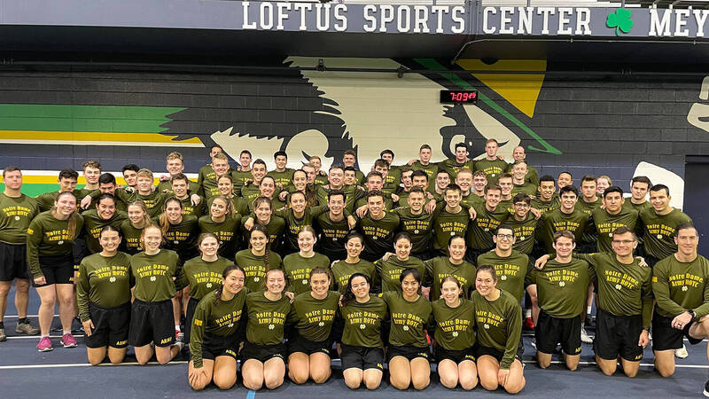Cadets pose for a group photo in their PT gear in the Loftus center on Notre Dame's campus